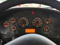 The dashboard of a 2013 International 4300 displaying various gauges including speedometer tachometer fuel and warning lights