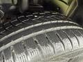 Close-up of a wet tire tread on a 2019 Ford Explorer showing intricate patterns and grooves for traction