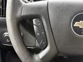 Steering wheel of a 2019 Chevrolet Express showing control buttons for cruise control and vehicle settings
