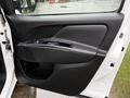 The image shows the interior door panel of a 2017 RAM ProMaster City featuring a black plastic design with a handle and window controls