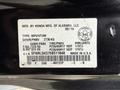 A 2014 Honda Odyssey vehicle identification label displaying manufacturing information and specifications