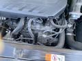 Close-up view of the engine of a 2018 Hyundai Santa Fe showing various components including hoses and sensors