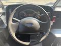 Interior view of a 2012 Ford E-450 dashboard featuring a steering wheel and instrument panel with gauges and controls