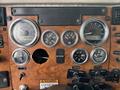 The dashboard of a 2008 Peterbilt 340 featuring various gauges including speedometer fuel tank and oil temperature indicators