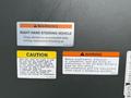 A warning label on a 2009 UD Trucks UD 3300 displaying instructions for right-hand steering vehicle operation and maintenance precautions