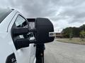 A 2023 Ford F-450 Super Duty with a large side mirror and a rugged design showcasing its heavy-duty capabilities