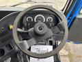 The image shows the steering wheel and dashboard of a 2017 Autocar Xpert with gauges and controls prominently displayed