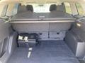 A 2015 Ford Escape with a spacious cargo area featuring a flat floor and a storage compartment on the right side