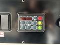 Control panel with buttons and indicators in a 2020 Mercedes-Benz Sprinter 2500 featuring options for info, auto, fan speeds, and auxiliary settings