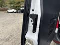 Close-up of the door handle and latch mechanism of a 2020 Mercedes-Benz Sprinter 2500