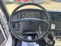 Steering wheel and dashboard of a 2014 Freightliner M2 106 with various controls and gauges visible