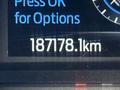 A close-up view of the digital display showing a mileage reading of 187178.1 km on a 2020 Ford F-350