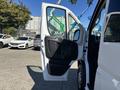 A 2020 RAM ProMaster 3500 with the driver's side door open displaying the interior door panel and handle