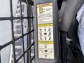Control panel of a 2017 Bobcat T740 showing joystick controls and warning information about loader movement and operation modes