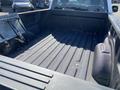Interior view of the bed of a 2018 Ford F-150 showing a rugged truck bed with a textured surface and no cargo inside