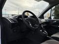 Interior view of a 2017 Ford Transit Connect featuring a steering wheel and dashboard with controls visible