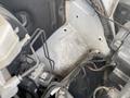 A close-up view of the engine compartment of a 2025 Mercedes-Benz Sprinter showing various mechanical components and wiring