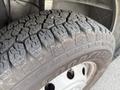 Close-up of a tire from a 2017 RAM Promaster showcasing detailed tread patterns and a visible brand name on the sidewall