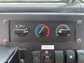 Control panel of a 2011 Workhorse W62 featuring knobs for temperature and ventilation settings along with switches for various functions