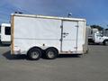 A 2008 Wells Industries Inc EW1422 trailer with a white exterior and two axles visible on the side