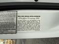 Barcode sticker with vehicle information for a 2002 Ford Econoline detailing emission control and compliance with environmental regulations