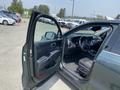 A 2022 Kia Sorento with an open front door showing the interior including the steering wheel and dashboard