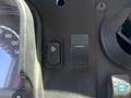 Close-up view of the dashboard control panel in a 2019 Freightliner MT45 featuring various buttons and a digital display showing vehicle information