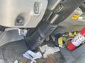 Interior view of a 2014 Hino 195 showing the dashboard area with pedals a steering column and scattered papers and debris on the floor