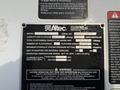 A close-up of a manufacturer’s specification plate for an Altec model A140P with details on capacity platform serial number and operational warnings