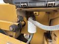 A close-up of a 2015 Vermeer Corporation BC1200XL machine showing a hydraulic filter and connected hoses