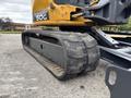 A 2017 John Deere 50G excavator track with a rugged design showing wear and tear from use