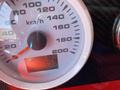Close-up of a 1962 Ford speedometer displaying a needle at 10 km/h and a digital odometer reading 153