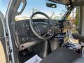 Interior view of a 2020 Chevrolet Express showing the steering wheel dashboard and controls