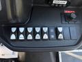 Control panel with various switches and buttons in a 2017 Ford Transit-350, including lights and dome controls