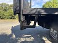 Side view of a 2014 RAM 5500 showing the flatbed and rear steps designed for easy access to the truck bed