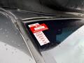 A 2020 Chevrolet Express with a red and white vehicle approval sticker displaying the months January to June