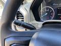 A close-up view of the steering wheel and dashboard controls of a 2020 Ford F-350 SD with various gauges and a turn signal stalk visible