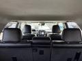 Interior view of a 2021 Toyota 4Runner featuring the backseat and dashboard visible ahead with two front seats in focus