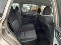 Interior view of a 2016 Subaru Forester showing the backseat with two seat cushions and headrests in black fabric