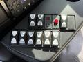 Control panel featuring various buttons for mirror defrost, lights, and lift operation in a 2020 Chevrolet Express