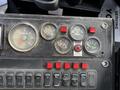 Dashboard of a 2012 International DuraStar 4300 featuring multiple gauges including speedometer and fuel level along with various control switches and indicator lights