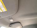 The ceiling of a 2018 Ford F-150 with a light switch and warning label visible