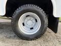 Close-up of a 2018 Ford F-350 wheel featuring a silver rim and all-terrain tire with rugged tread design