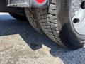 Close-up of a 2016 Isuzu NPR-HD truck tire showcasing its tread pattern and sidewall details