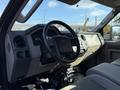 Interior view of a 2008 Ford F-550 showing the dashboard steering wheel and control panel