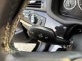 Close-up of the gear selector lever of a 2013 BMW X3 showing options for BC reverse parking and other driving functions