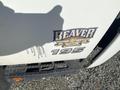 Close-up of a white Hino 195 truck with a "BEAVER TRUCK CENTRE" logo and the number 195 displayed prominently