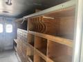 Interior view of a 2007 Morgan Olson Workhorse W42 featuring wooden shelves and cabinets designed for storage and organization