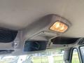 The image shows the interior ceiling of a 2014 International 7400 featuring a light fixture and vents for air circulation
