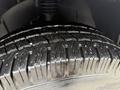 Close-up of a tire from a 2016 Mercedes-Benz Sprinter showing detailed tread patterns and textures